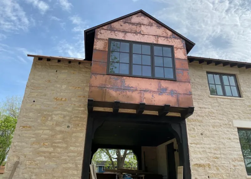 Copper metal panel facade on a stone building for Metal Roof Coating in Cortez