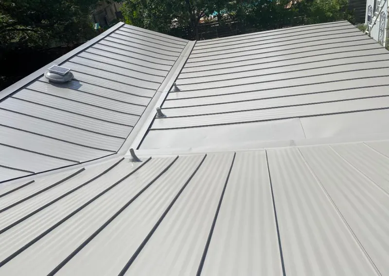 Solar attic fan installed on a metal roof for Roof Ventilation in Cortez